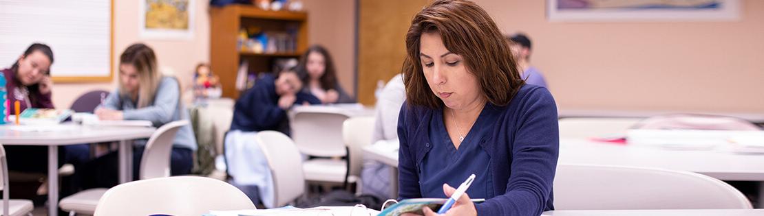 An adult learner studies at a Pima Adult Learning Center